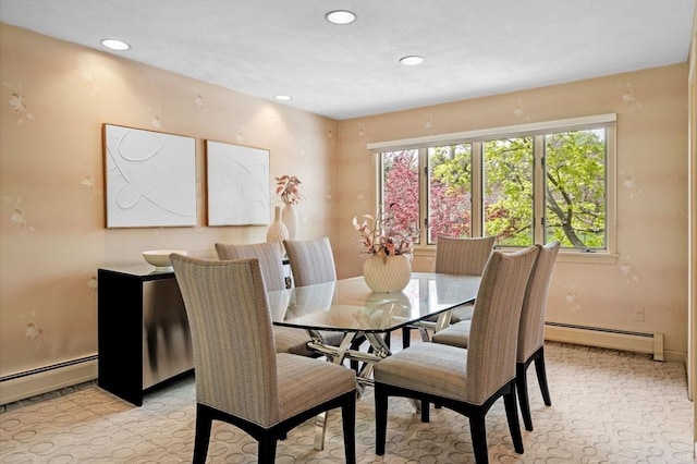 dining space with a baseboard heating unit and recessed lighting