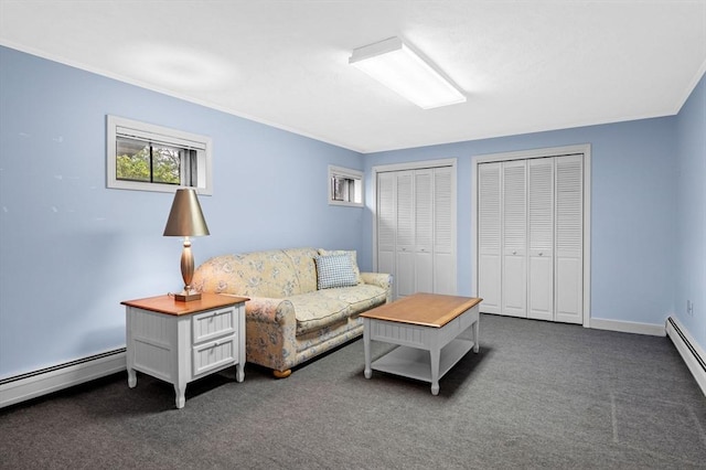 living room with dark carpet, a baseboard radiator, and crown molding