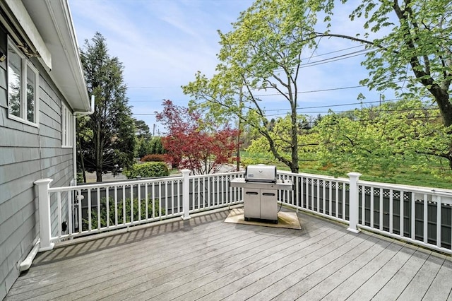 wooden deck featuring grilling area