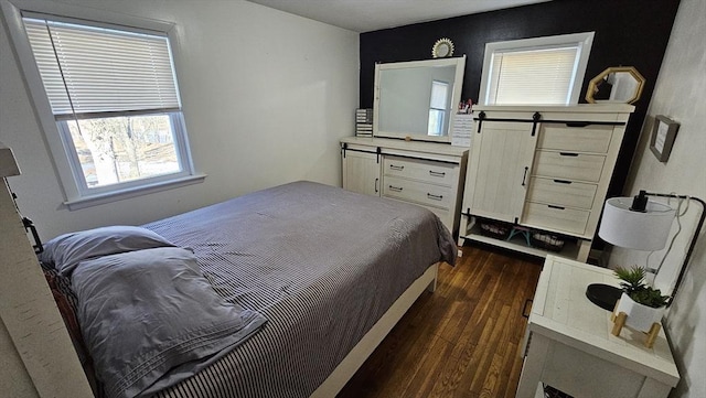 bedroom featuring dark wood-style floors