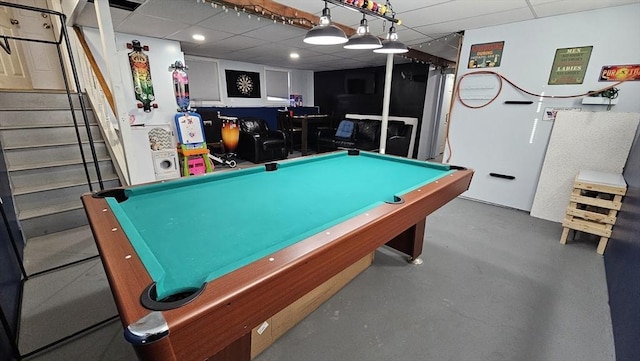 playroom featuring concrete floors, billiards, and a paneled ceiling