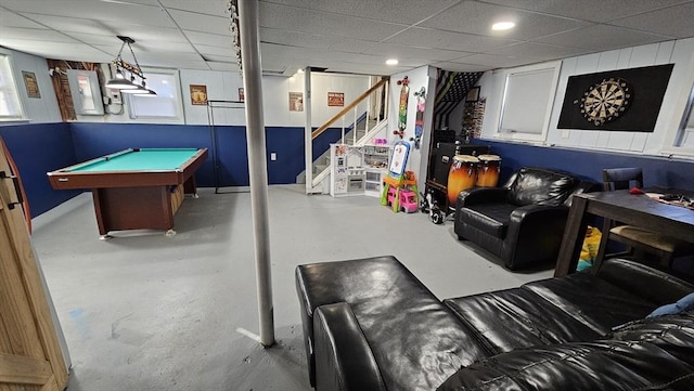 game room with finished concrete floors, a paneled ceiling, electric panel, and billiards