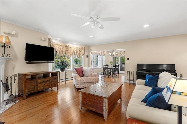 4 Crestwood, Marblehead, MA 01945 - living room with baseboard heating, wood finished floors, ceiling fan, a chandelier, and crown molding