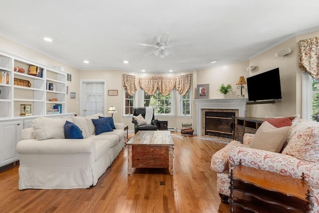 4 Crestwood, Marblehead, MA 01945 - living area featuring ceiling fan, light wood-type flooring, ornamental molding, a fireplace with flush hearth, and recessed lighting