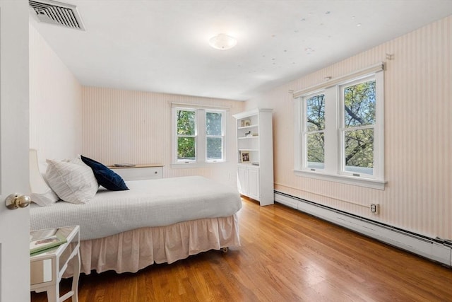 4 Crestwood, Marblehead, MA 01945 - bedroom with a baseboard radiator, wood finished floors, and wallpapered walls