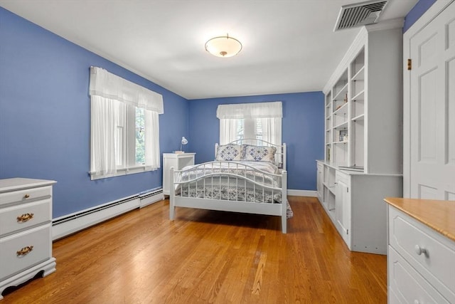 4 Crestwood, Marblehead, MA 01945 - bedroom featuring a baseboard heating unit, light wood-type flooring, and baseboards