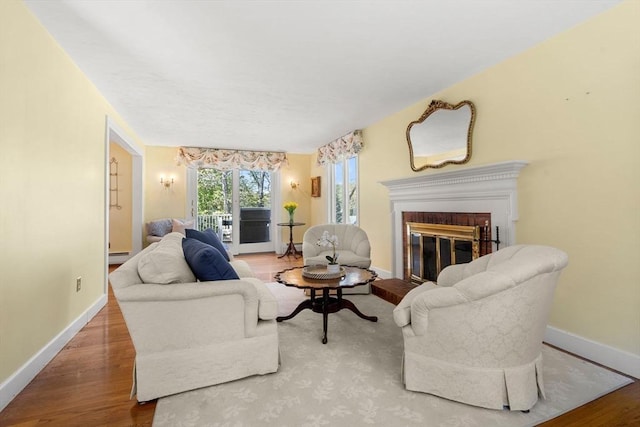 4 Crestwood, Marblehead, MA 01945 - living room with wood finished floors, baseboards, and a brick fireplace