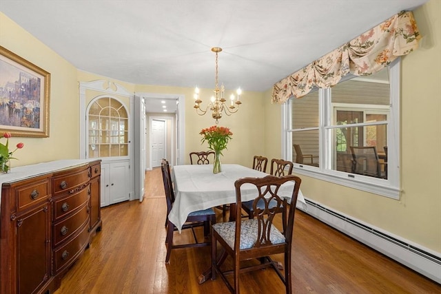 4 Crestwood, Marblehead, MA 01945 - dining area featuring a baseboard radiator, a chandelier, and light wood-style flooring
