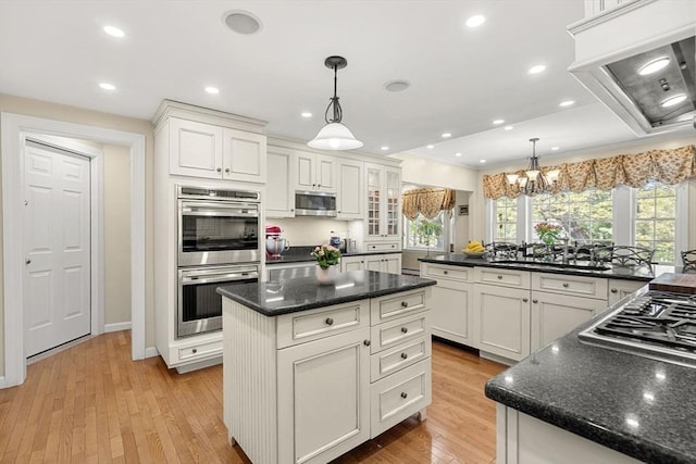 4 Crestwood, Marblehead, MA 01945 - kitchen with appliances with stainless steel finishes, a center island, white cabinets, light wood-type flooring, and a chandelier