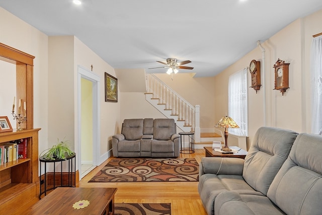 living room with hardwood / wood-style floors and ceiling fan