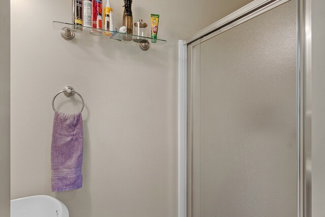 bathroom featuring an enclosed shower