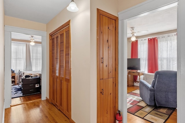 hall with light hardwood / wood-style flooring