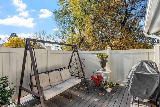 wooden deck featuring area for grilling