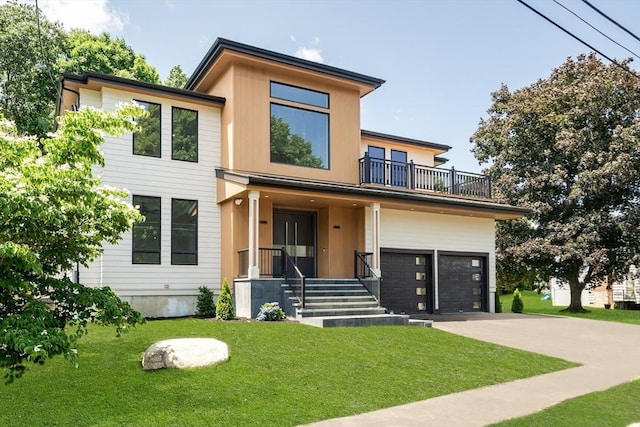 contemporary house with a balcony, a front lawn, and a garage