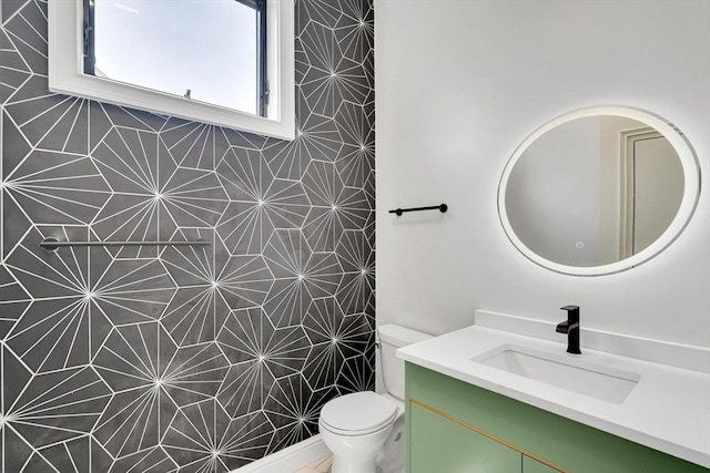 bathroom with vanity and toilet