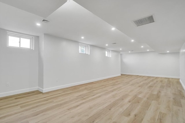 basement featuring light hardwood / wood-style floors