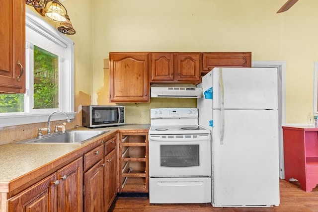 49 Boathouse Rd, Groton, MA 01450 - kitchen featuring white appliances, under cabinet range hood, a sink, and wood finished floors