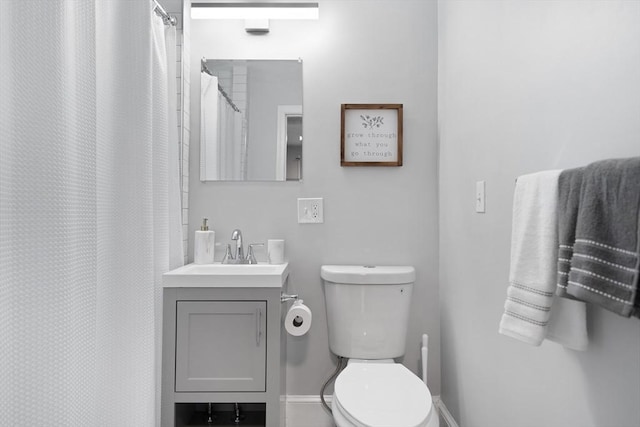 bathroom with toilet and vanity
