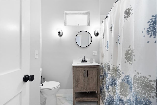 bathroom with marble finish floors, toilet, vanity, and a shower with shower curtain