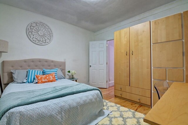 bedroom featuring light wood-type flooring