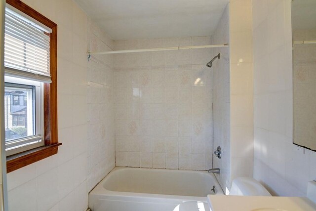 full bath featuring toilet, bathing tub / shower combination, and vanity