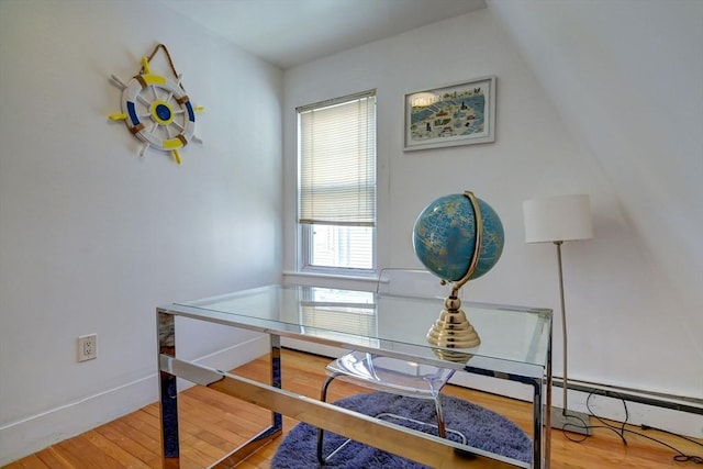 office space featuring baseboards and wood finished floors