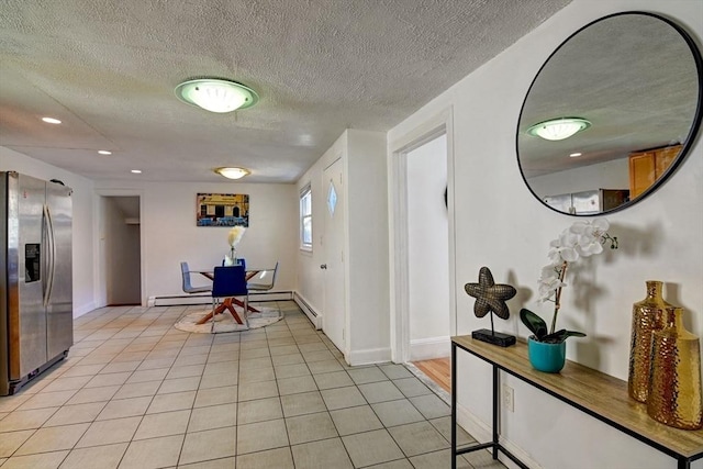 corridor featuring a textured ceiling, recessed lighting, light tile patterned flooring, and baseboards
