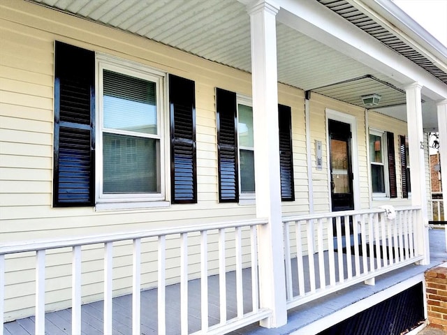 view of side of home featuring a porch