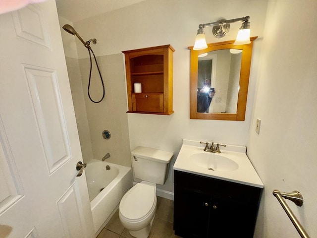 full bathroom with vanity, tiled shower / bath, tile patterned floors, and toilet