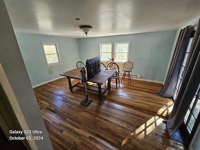 dining room with dark wood-type flooring