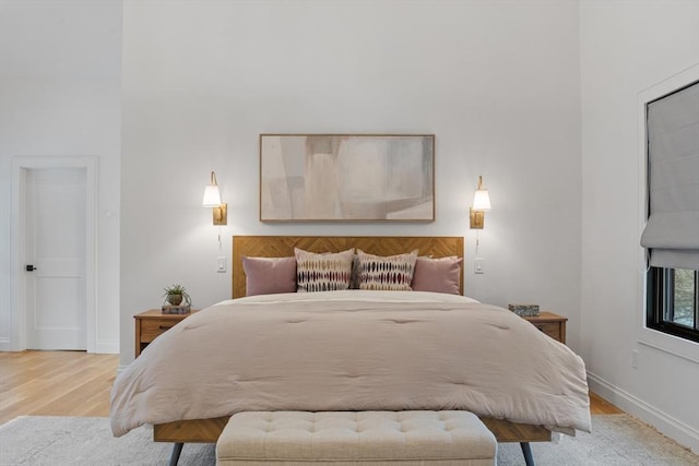 bedroom with light hardwood / wood-style flooring