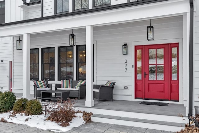 view of exterior entry with covered porch