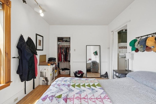 46 Hunting St, Somerville, MA 02143 - bedroom featuring wood-type flooring and a spacious closet