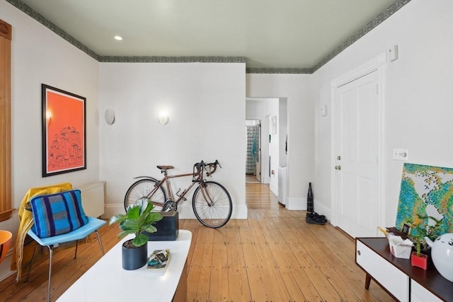 46 Hunting St, Somerville, MA 02143 - hallway with light wood finished floors, baseboards, crown molding, and recessed lighting