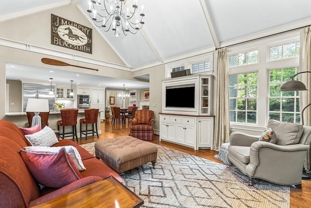 21 Fernway, Winchester, MA 01890 - living area with a chandelier, high vaulted ceiling, healthy amount of natural light, wood finished floors, and beam ceiling