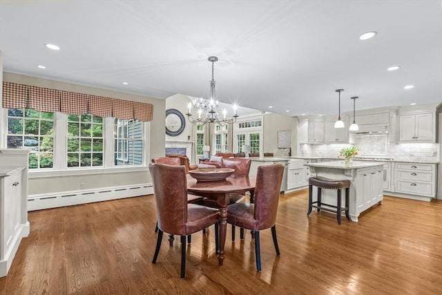 21 Fernway, Winchester, MA 01890 - dining area featuring baseboard heating, light wood-style flooring, a chandelier, and recessed lighting