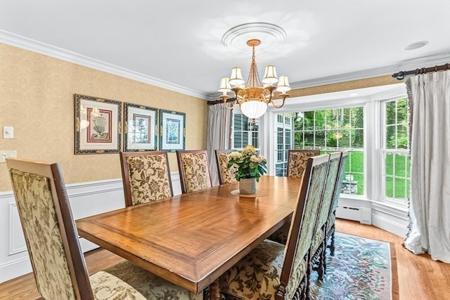 21 Fernway, Winchester, MA 01890 - dining space featuring a chandelier, wainscoting, crown molding, light wood finished floors, and baseboard heating