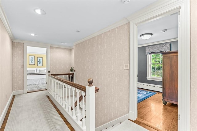 21 Fernway, Winchester, MA 01890 - hall featuring baseboard heating, an upstairs landing, ornamental molding, wood finished floors, and baseboards