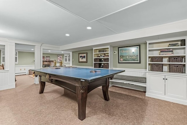 21 Fernway, Winchester, MA 01890 - playroom featuring baseboard heating, light carpet, built in shelves, wainscoting, and a decorative wall