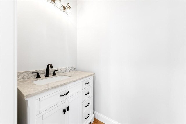 bathroom featuring vanity and baseboards