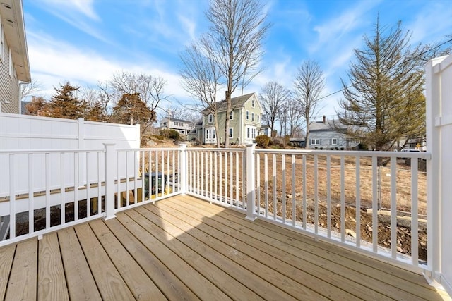 wooden deck with a residential view