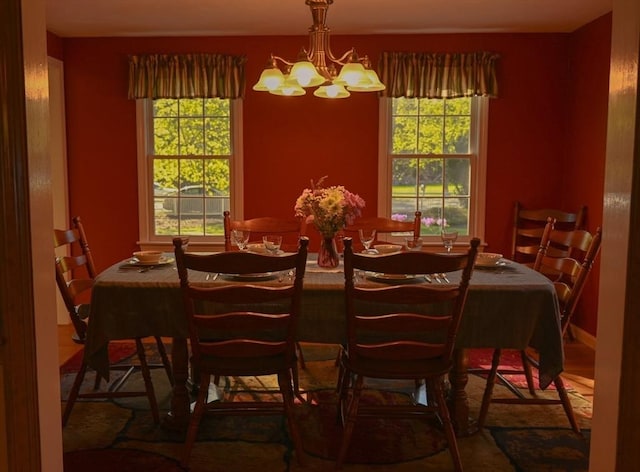 dining room with an inviting chandelier and plenty of natural light
