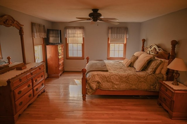 bedroom featuring ceiling fan and light wood-style flooring