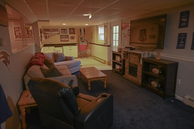 carpeted living room featuring a baseboard radiator and a paneled ceiling
