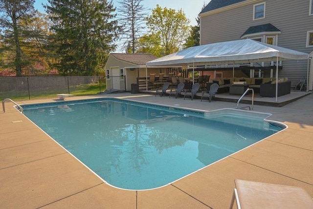 view of pool featuring a patio, fence, an outdoor hangout area, and a fenced in pool