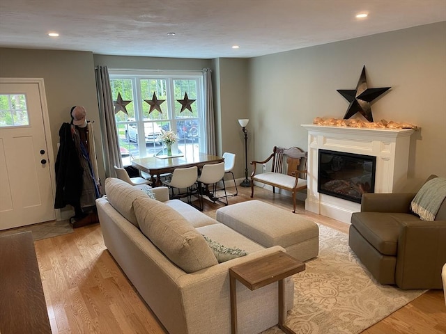 30 Old Washington St Unit 2, Pembroke, MA 02359 - living room with healthy amount of natural light, recessed lighting, light wood-style floors, and a glass covered fireplace