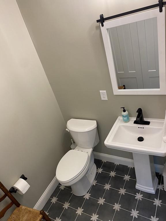 30 Old Washington St Unit 2, Pembroke, MA 02359 - bathroom with baseboards and toilet