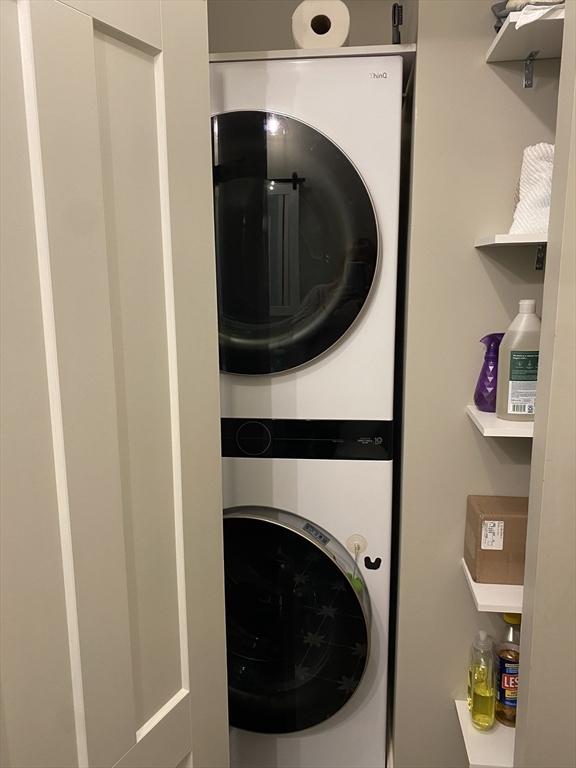 30 Old Washington St Unit 2, Pembroke, MA 02359 - clothes washing area featuring stacked washer and clothes dryer