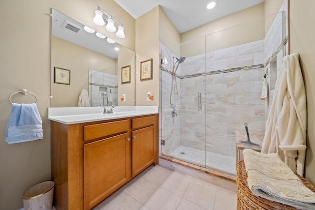 bathroom featuring a stall shower, tile patterned flooring, visible vents, and vanity