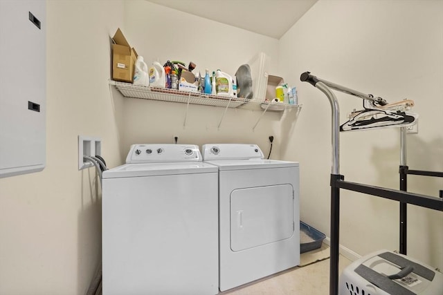 clothes washing area with laundry area, electric panel, and independent washer and dryer